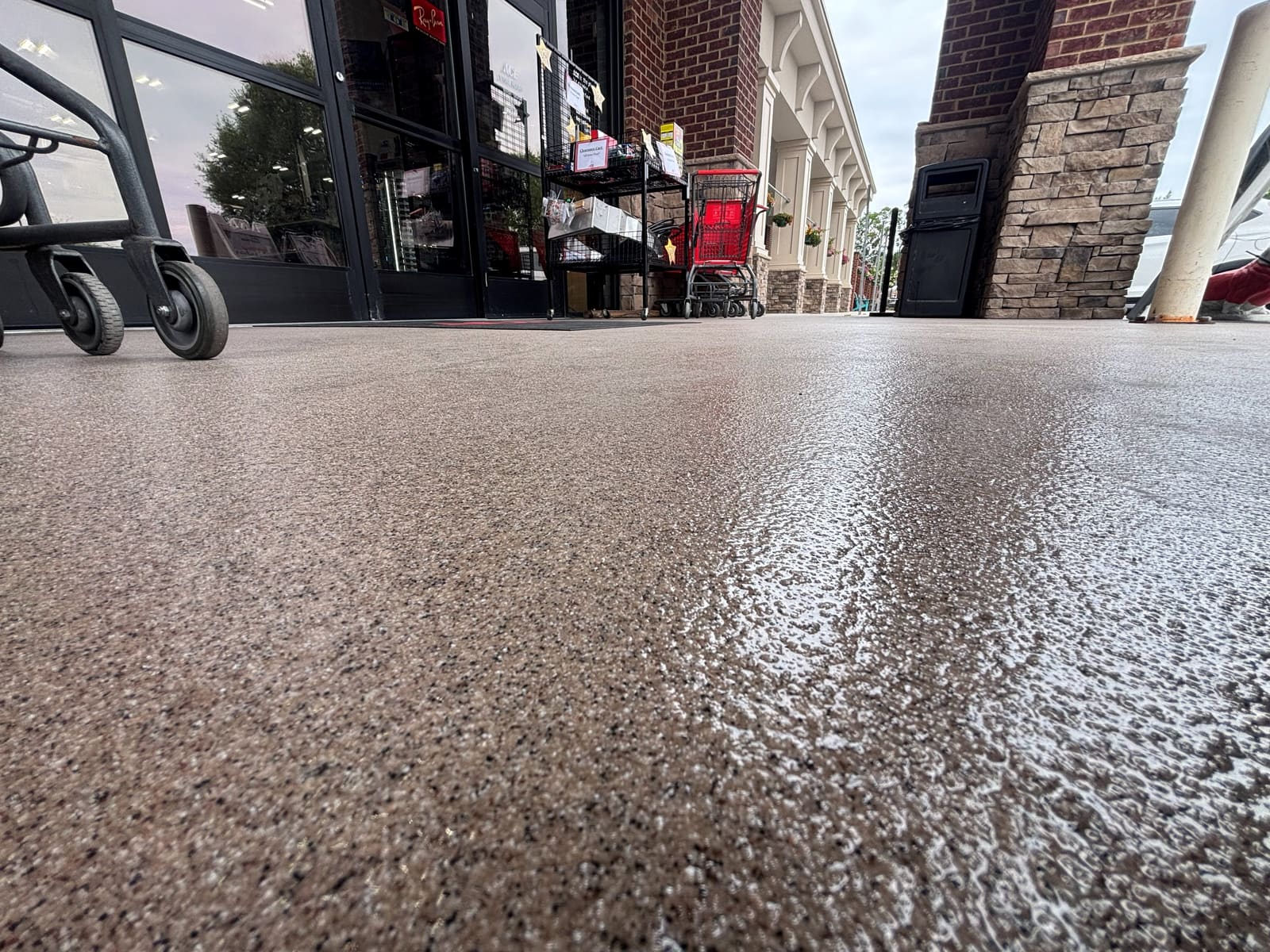 Quartz-coated outdoor concrete walkway at a storefront