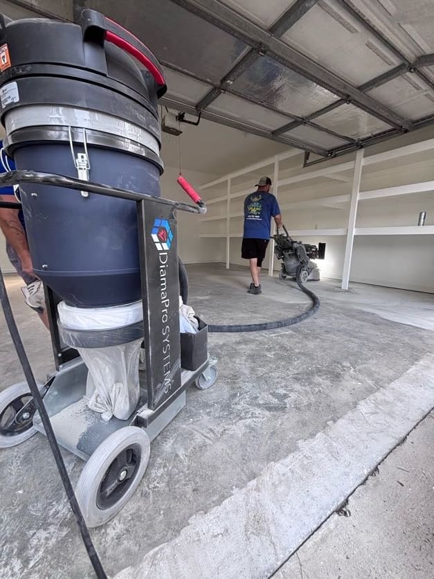 Industrial HEPA dust extractor capturing dust during diamond grinding