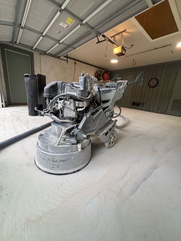 Propane planetary diamond grinder on a freshly ground garage slab